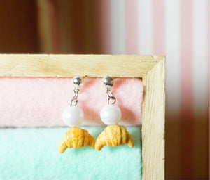 Dangling croissant earrings